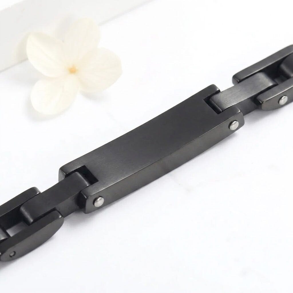 Black stainless steel chain-link cremation bracelet, back view showing blank engraving plate for custom personalization