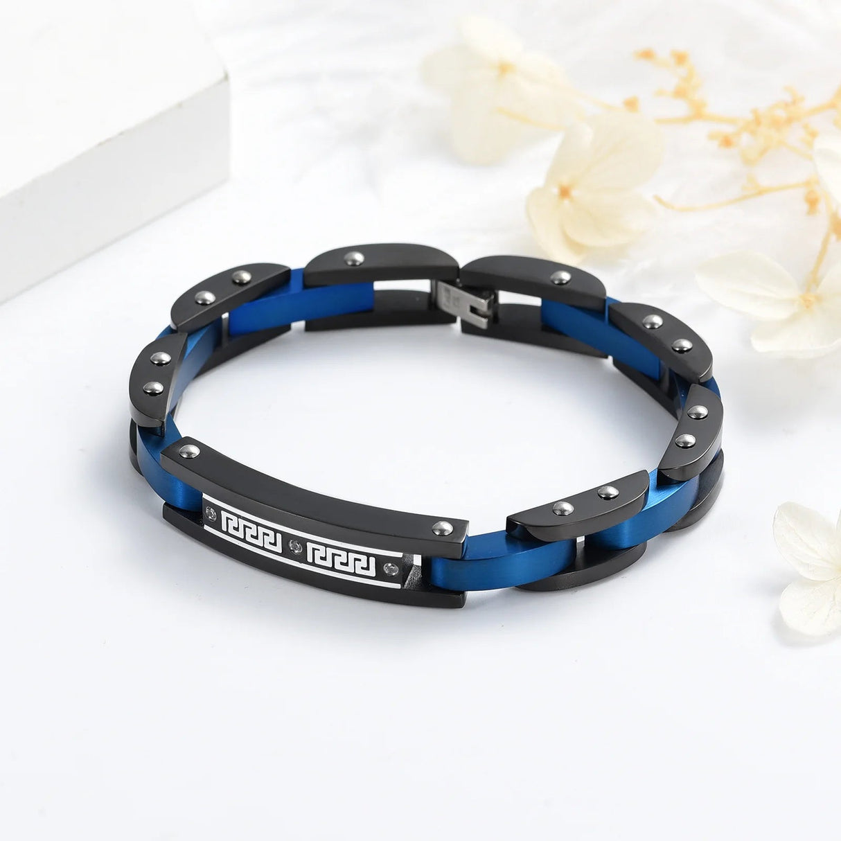 Blue chain link cremation bracelet with secure ash chamber