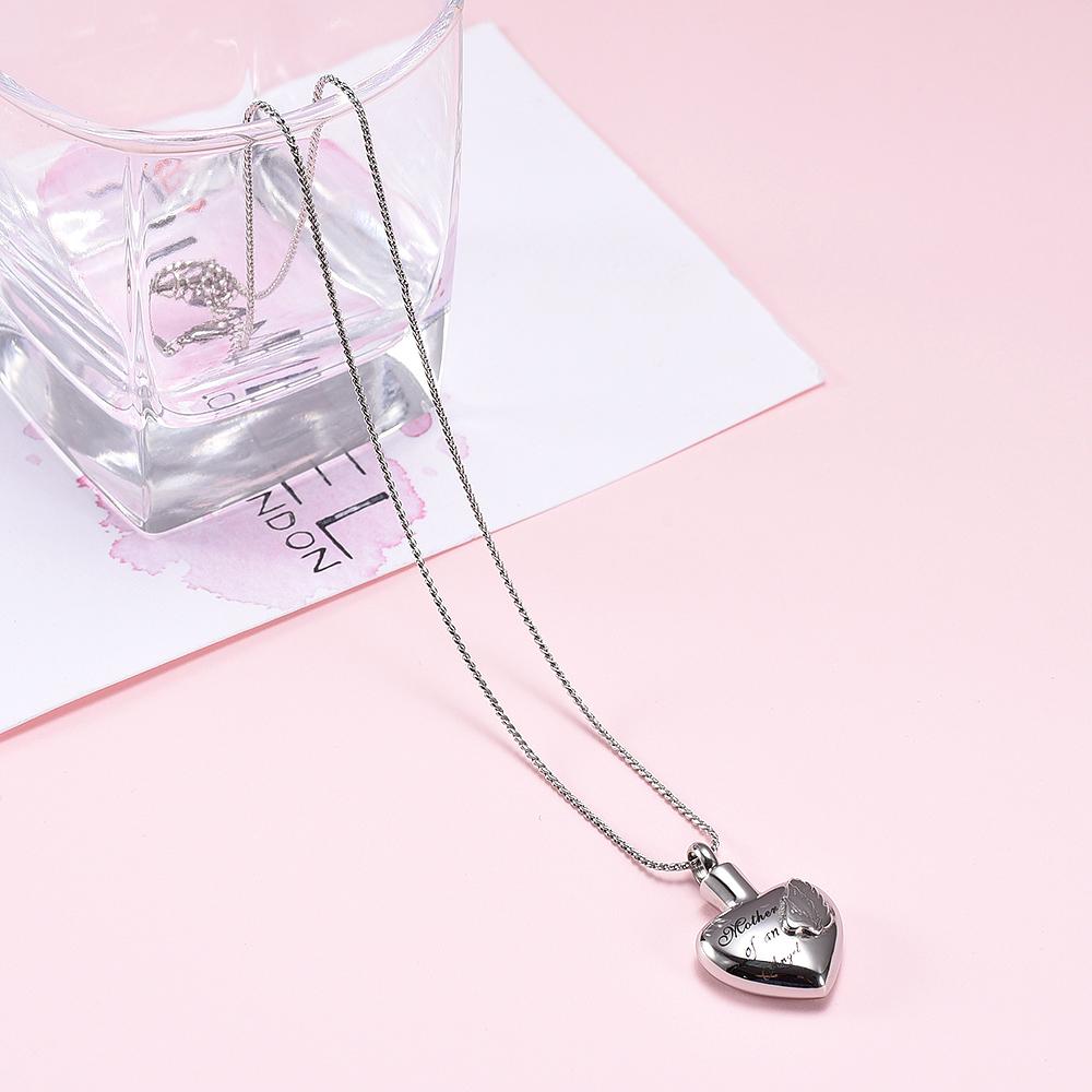 Cremation Necklace - Silver Heart Shaped Cremation Urn Necklace With Angel Wings Engraved "Mother Of An Angel"