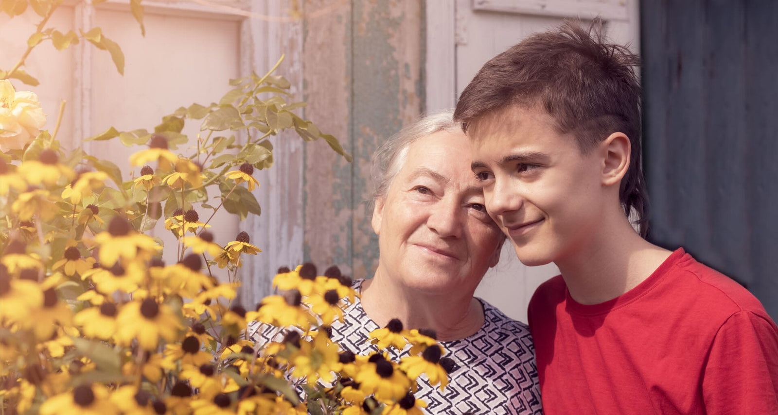 Depiction of a grandson and grandma together in a garden.
