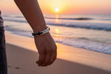 Chain link cremation bracelet worn on a man's wrist